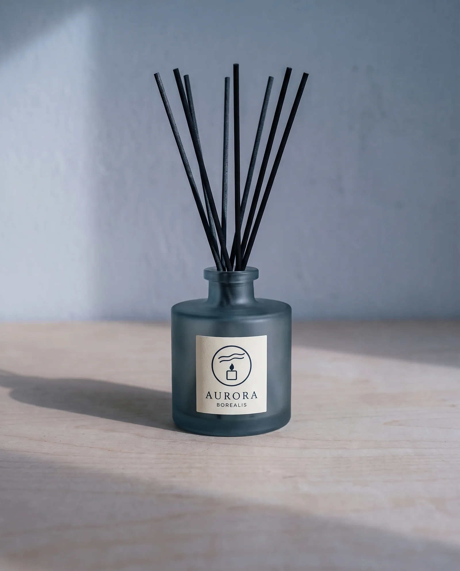 Borealis Reed Diffuser 100 ml — Black spruce, vetiver, cold air · smoke-blue bottle